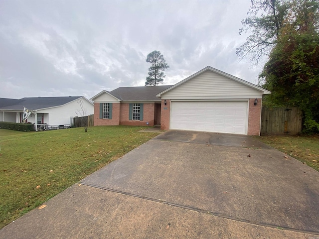 ranch-style house featuring a front lawn and a garage