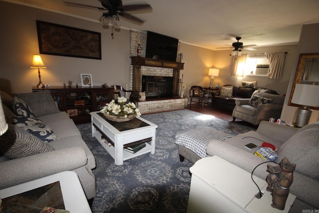 living room featuring a fireplace, ceiling fan, and wood-type flooring