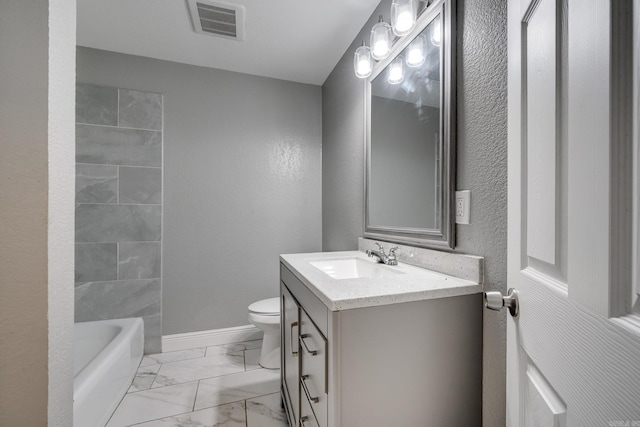 bathroom with toilet and vanity