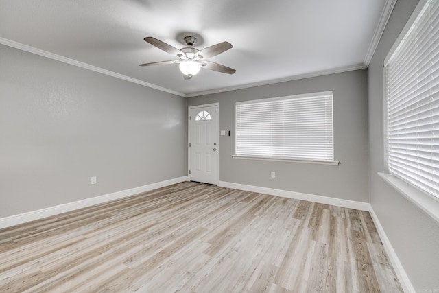 entrance foyer featuring ceiling fan, light hardwood / wood-style floors, and crown molding