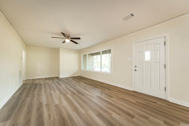 entryway with wood-type flooring and ceiling fan