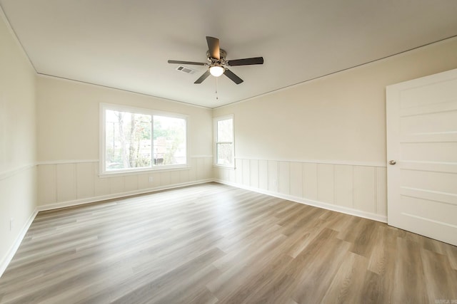 empty room featuring ceiling fan and light wood-type flooring