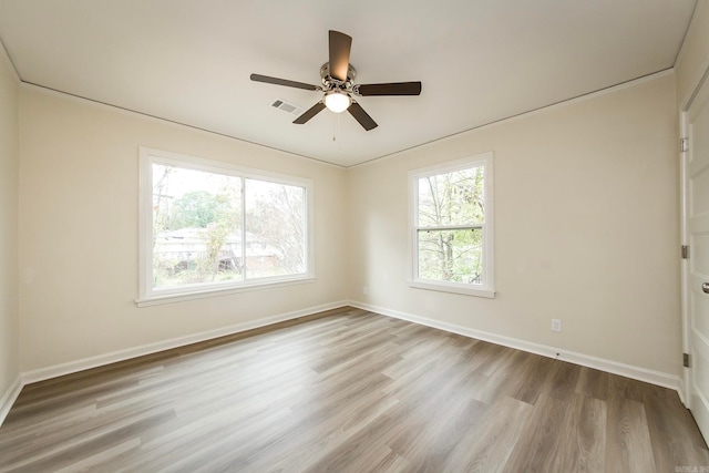 empty room featuring ceiling fan and light wood-type flooring