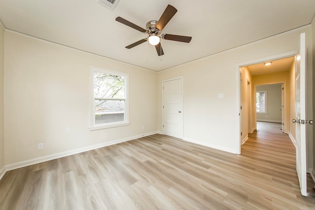 unfurnished bedroom with a closet, light wood-type flooring, and ceiling fan