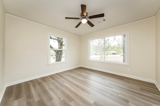 unfurnished room with ceiling fan and light hardwood / wood-style floors