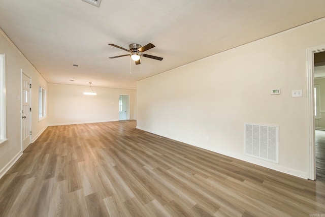 empty room with hardwood / wood-style flooring and ceiling fan