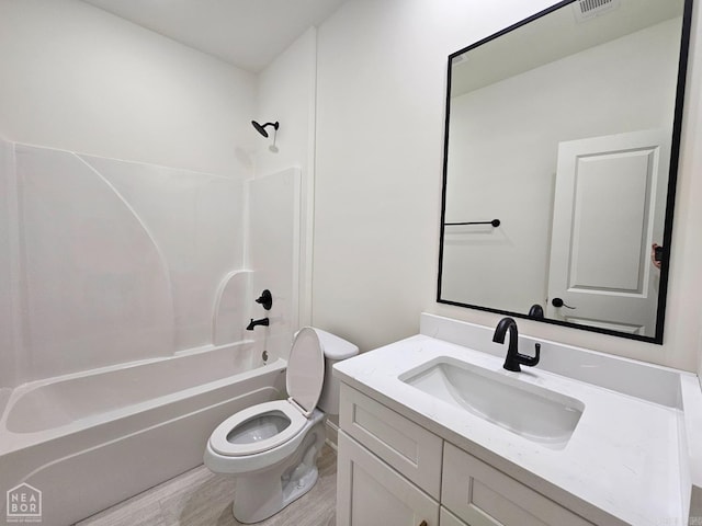 full bathroom with toilet, shower / bathing tub combination, vanity, and hardwood / wood-style floors