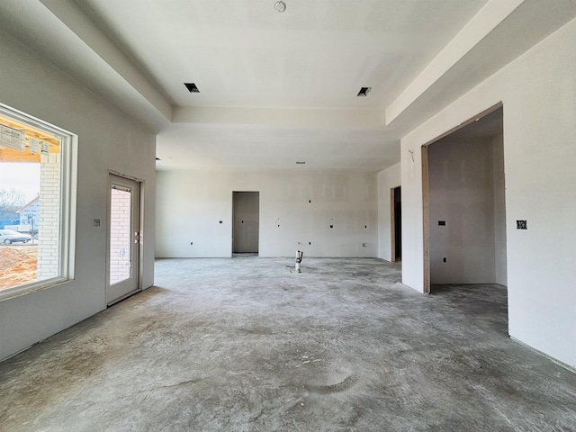 spare room with a raised ceiling