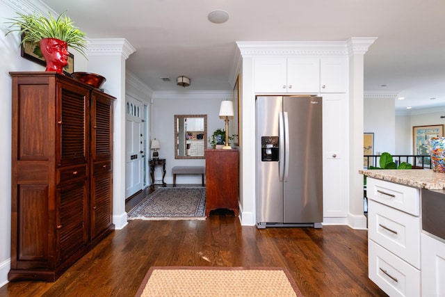 kitchen with white cabinetry, light stone countertops, dark hardwood / wood-style floors, crown molding, and stainless steel fridge with ice dispenser