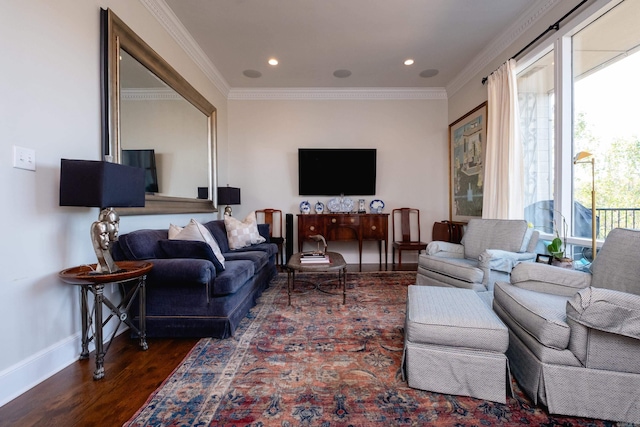 living room with dark hardwood / wood-style flooring and ornamental molding