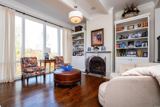 living area with ornamental molding, built in features, and dark hardwood / wood-style floors