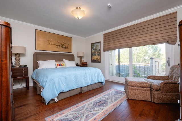 bedroom with dark wood-type flooring, access to exterior, and crown molding