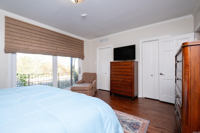 bedroom with access to outside, dark wood-type flooring, crown molding, and a closet