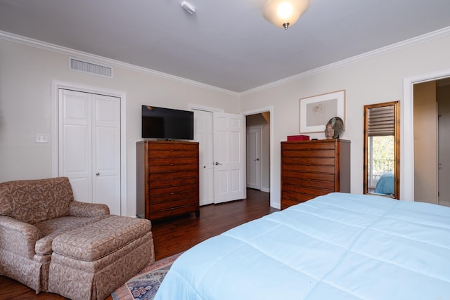 bedroom featuring dark hardwood / wood-style floors and crown molding