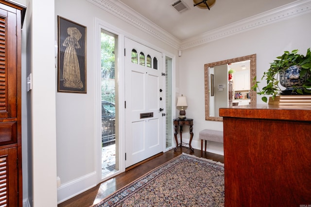 entryway featuring dark wood-type flooring and crown molding