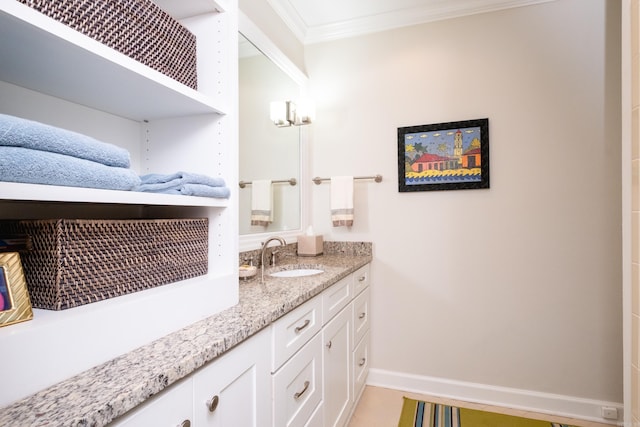 bathroom featuring ornamental molding and vanity