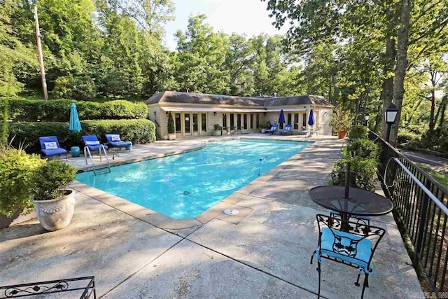 view of swimming pool featuring a patio