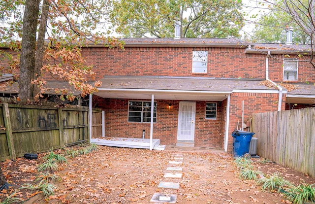 200 Pine Forest Dr Apt C2, Maumelle, AR 72113 - rear view of house featuring brick siding and a fenced backyard