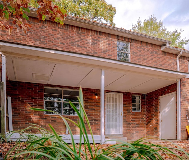 200 Pine Forest Dr Apt C2, Maumelle, AR 72113 - property entrance featuring a porch and brick siding