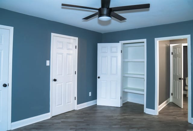 unfurnished bedroom featuring dark wood-type flooring and ceiling fan