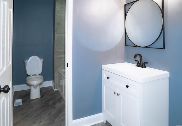 200 Pine Forest Dr Apt C2, Maumelle, AR 72113 - full bathroom with vanity, toilet, baseboards, and wood finished floors