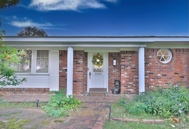 2006 S Prairie St, Stuttgart, AR 72160 - entrance to property featuring brick siding and covered porch