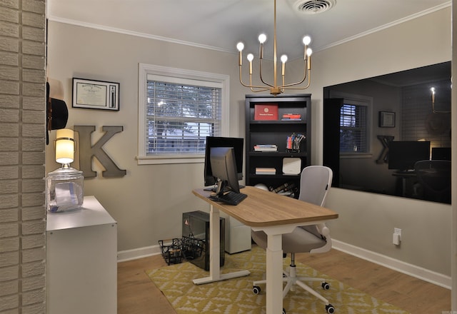 2006 S Prairie St, Stuttgart, AR 72160 - home office featuring wood finished floors, baseboards, ornamental molding, and a chandelier