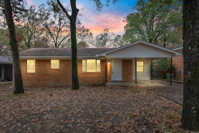 ranch-style house with a carport