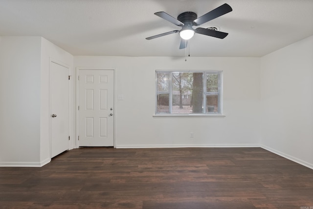 unfurnished room with ceiling fan and dark hardwood / wood-style floors