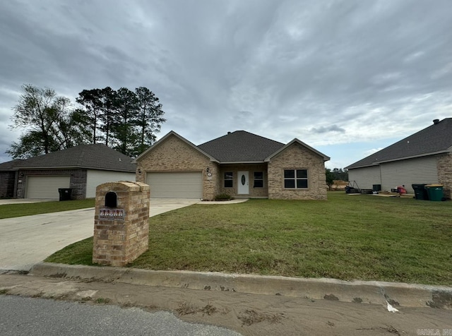 view of front of property featuring a garage and a front yard