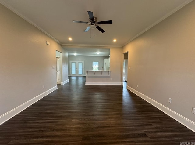 unfurnished living room with dark hardwood / wood-style flooring, french doors, ceiling fan, and crown molding