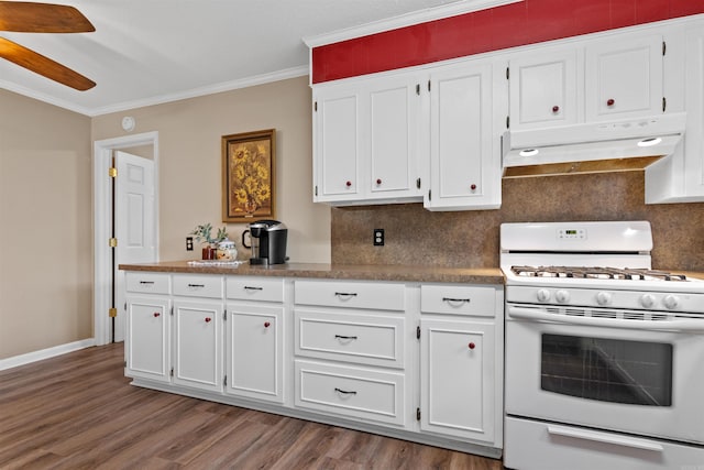 kitchen featuring dark hardwood / wood-style flooring, white cabinetry, ceiling fan, and white gas stove