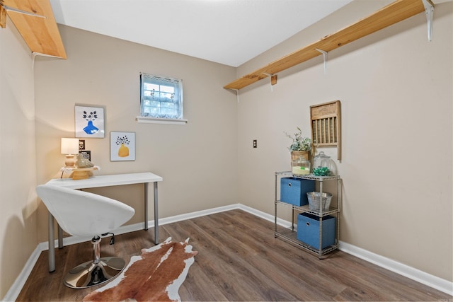 home office with dark hardwood / wood-style flooring