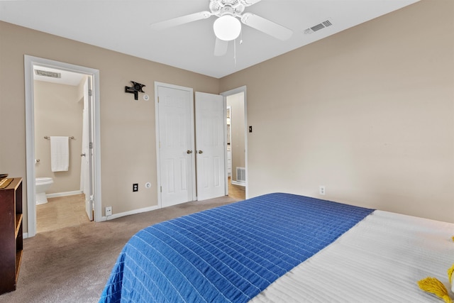 carpeted bedroom featuring ensuite bathroom and ceiling fan