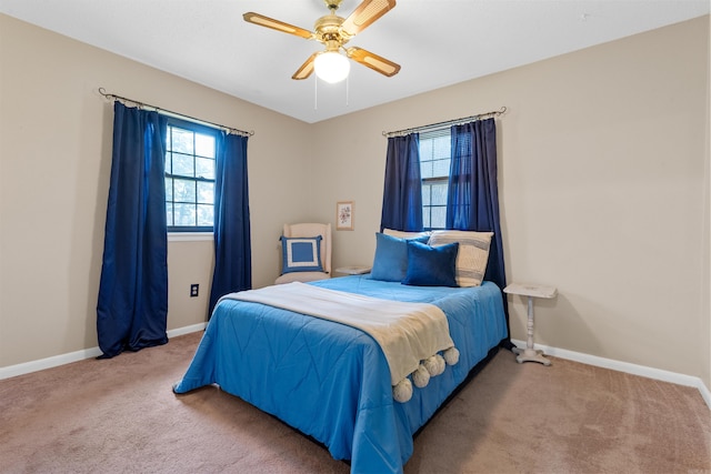 bedroom with ceiling fan and carpet