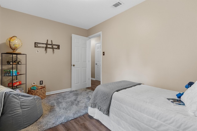 bedroom featuring hardwood / wood-style floors