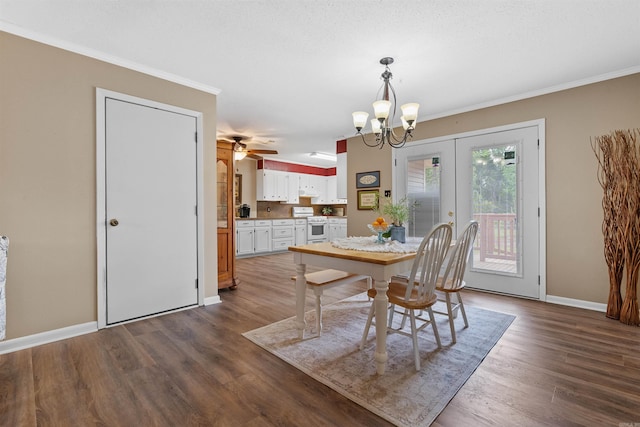 dining space featuring french doors, ceiling fan with notable chandelier, dark hardwood / wood-style floors, and crown molding