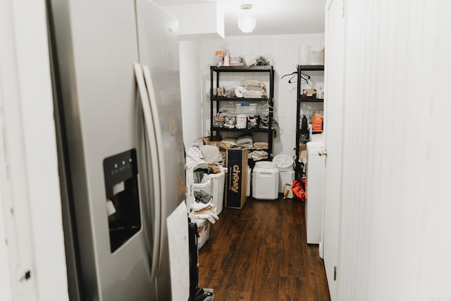 interior space with white cabinetry, stainless steel refrigerator with ice dispenser, and dark wood-type flooring