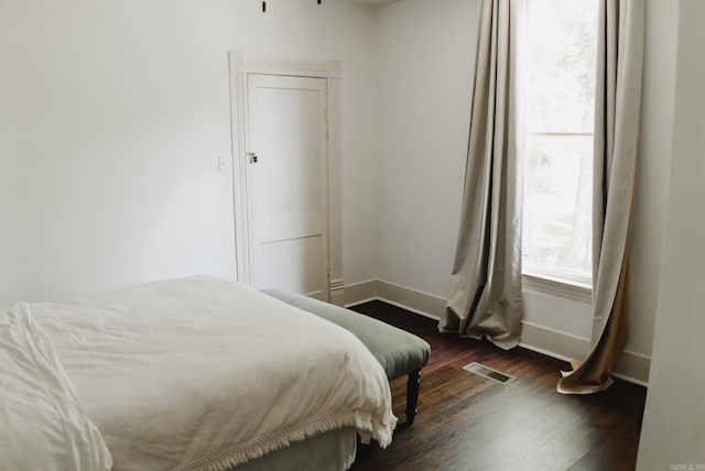 bedroom featuring dark hardwood / wood-style floors