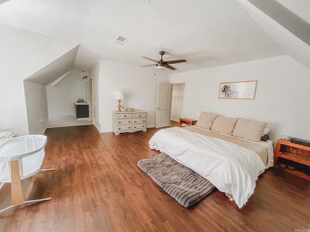 bedroom with vaulted ceiling, ceiling fan, and dark hardwood / wood-style flooring