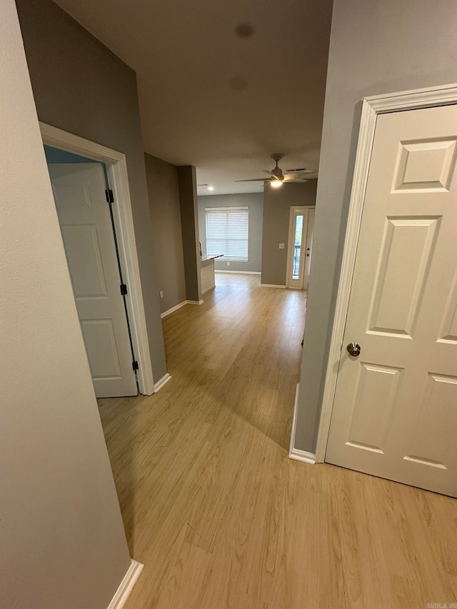 hall with light hardwood / wood-style floors