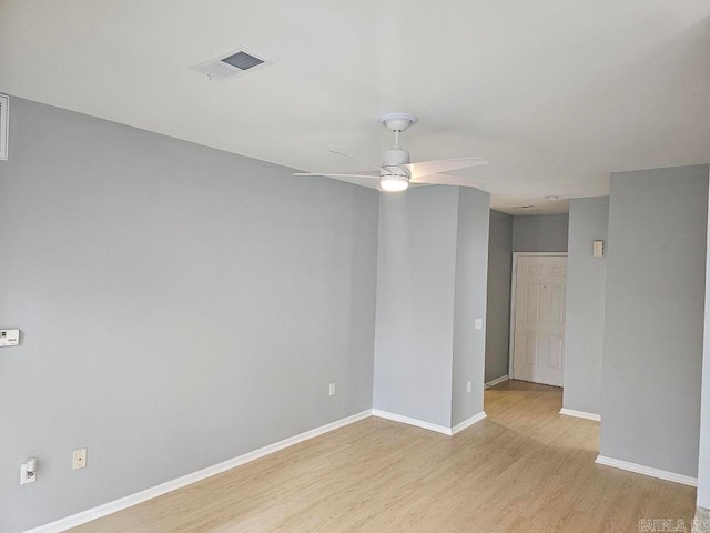 empty room with light hardwood / wood-style floors and ceiling fan