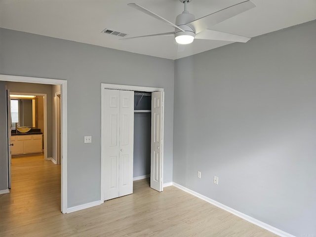 unfurnished bedroom featuring a closet, ceiling fan, and light hardwood / wood-style floors