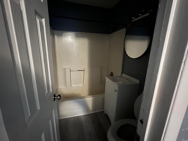 full bathroom featuring wood-type flooring, vanity, toilet, and shower / bath combination