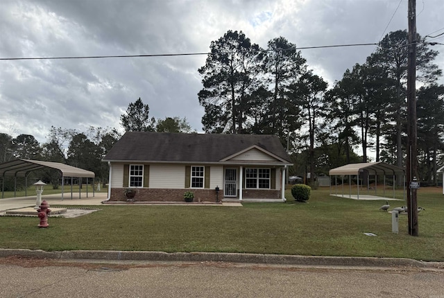 view of front facade with a front lawn and a carport