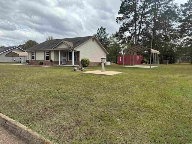 view of front of home with a front lawn, a garage, and a carport