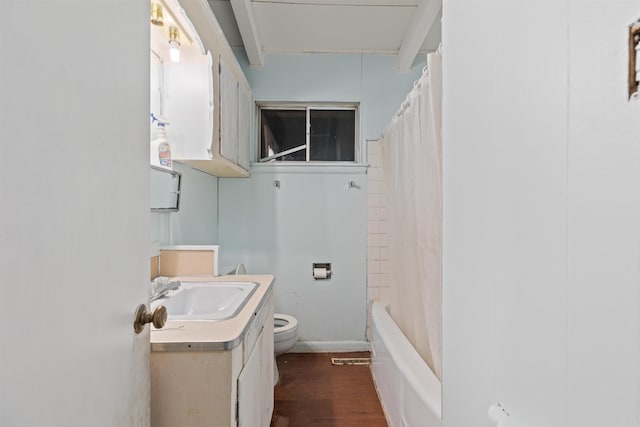 full bathroom with wood-type flooring, vanity, toilet, and shower / tub combo with curtain