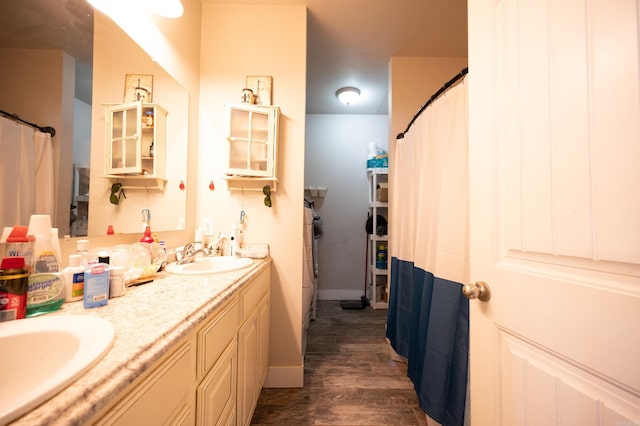 bathroom with wood-type flooring and vanity