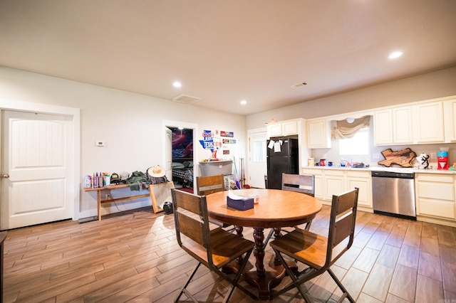 dining room with light wood-type flooring