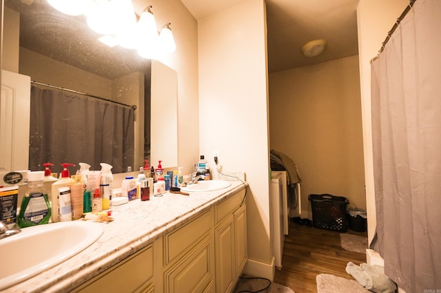 bathroom with hardwood / wood-style flooring and vanity